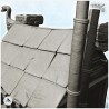 Viking house with large chimney and exterior pipes with wooden emblems (8)