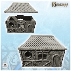 Rectangular medieval house with tiled roof and round window (21)