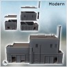 Modern industrial building with barricaded window, chimney, and roll-up doors (6)