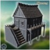 Medieval wooden house with stone foundation, detailed stairs, and fortified balcony (3)