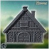 Medieval timber-framed house with thatched roof, chimney, and wooden reinforcements (10)