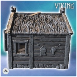 Bâtiment viking en bois avec toit en chaume et annexe en pierre et poisson accroché (17)