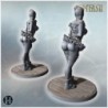 Duo of playful clown women with detailed corset, ruffled skirt, and fishnet stockings on wooden base (15)