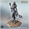 Succubus with alluring pose, holding flame, standing barefoot on a hexagonal sandy platform (22)