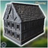 Large medieval house with wooden balconies, stone foundation, and a detailed roof structure (50)