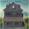 Square medieval house with symmetrical windows, wooden shutters, and small entrance staircase (52)