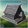 Rustic wooden house with overlapping roof shingles, thick wooden beams, and carved pillars (53)