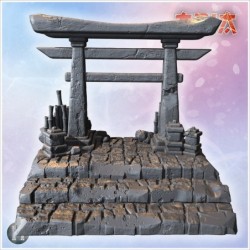 Small torii gate on stone steps with surrounding decorative bamboo and stacked rocks (5)