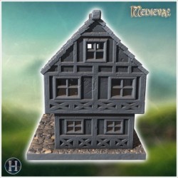 Two-story medieval house with a steep roof, multiple windows, and stone foundation (6)