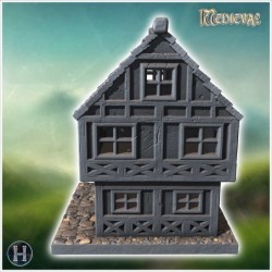 Two-story medieval house with timber framing, small windows, and cobblestone base (7)