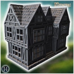 Two-story half-timbered house with detailed windows, arched doorway, and a steep tiled roof (44)