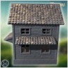 Small wooden cottage with circular window and sloped shingle roof (56)