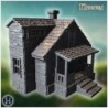 Stone house with twin gables, wooden porch, and detailed window frames (60)