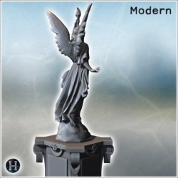 Statue of an angelic figure holding a torch, standing on a decorated pedestal (Carentan, Normandy 1944, France) (1)