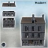 Tall, narrow building with large ground-floor windows and decorative upper balconies (Carentan, Normandy 1944, France) (3)