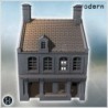 House with two chimneys, sloped roof, and small attached annex with single window (Carentan, Normandy 1944, France) (39)