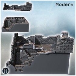 Bâtiment en pierre fortement endommagé avec structure en acier exposée et toit manquant (4)