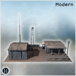 Small industrial complex with corrugated metal roofs, water tower, and antenna structures (9)