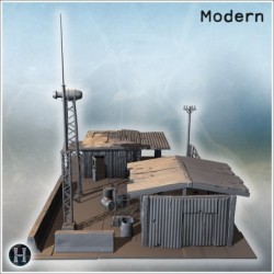 Small industrial complex with corrugated metal roofs, water tower, and antenna structures (9)