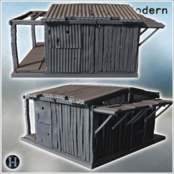 Petite cabane en métal ondulé avec toit endommagé et supports en bois sur une plateforme simple (12)