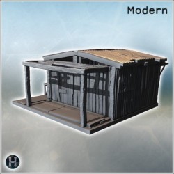 Petite cabane en métal ondulé avec toit endommagé et supports en bois sur une plateforme simple (12)