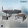 Metallic aircraft fuselage on supports with attached equipment cart and steps (6)