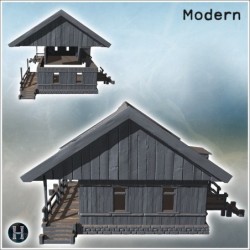 Traditional wooden house with a raised porch and steps leading to the entrance (8)