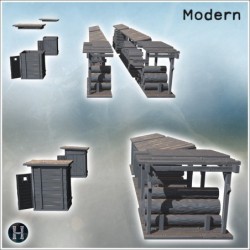 Group of wood sheds with logs stacked, small wooden storage units adjacent (10)