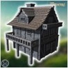 Half-timbered medieval house with a large balcony, stone foundation, and wooden railings (26)