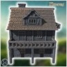 Half-timbered medieval house with a large balcony, stone foundation, and wooden railings (26)